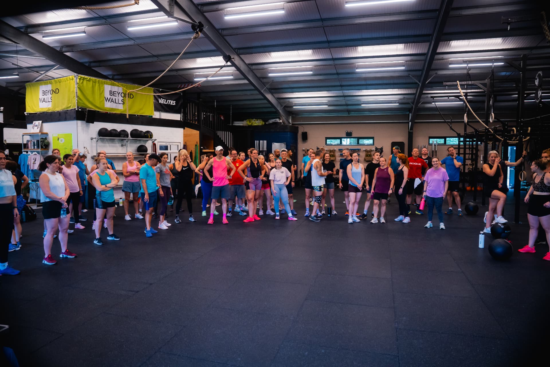 The Beyond Walls community gathered in a large circle inside the gym
