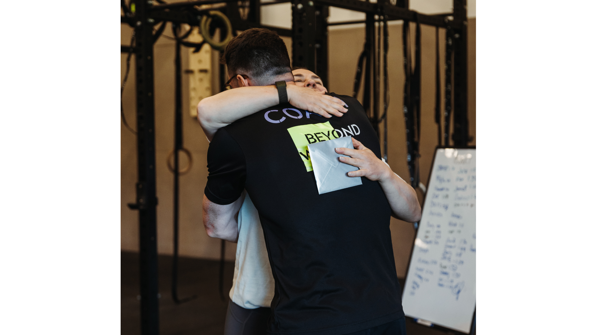 Coach embracing a member at Beyond Walls