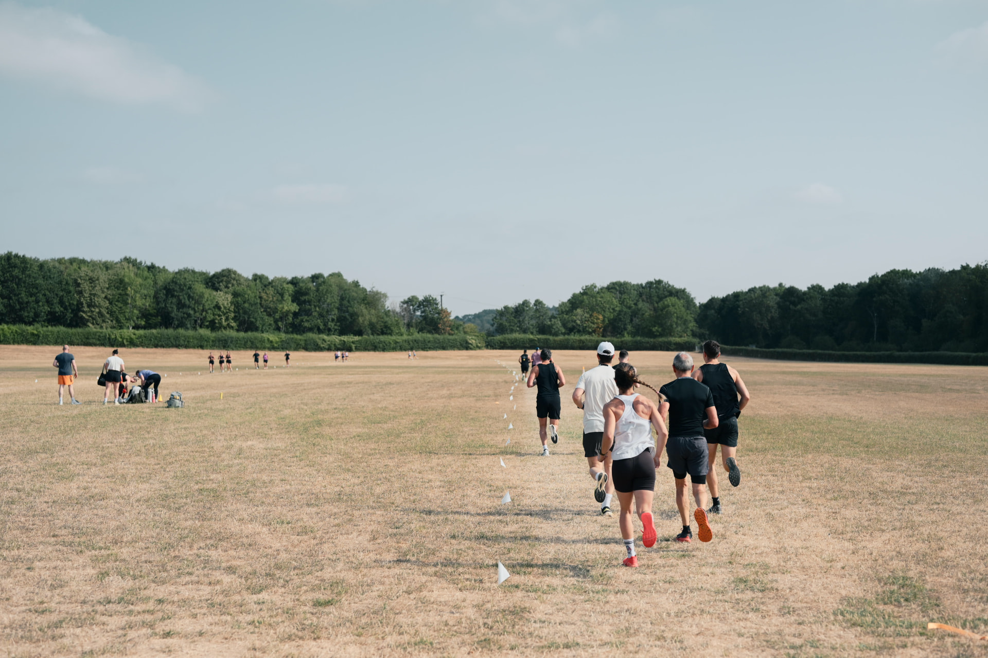 Beyond Walls members running together across a field in training