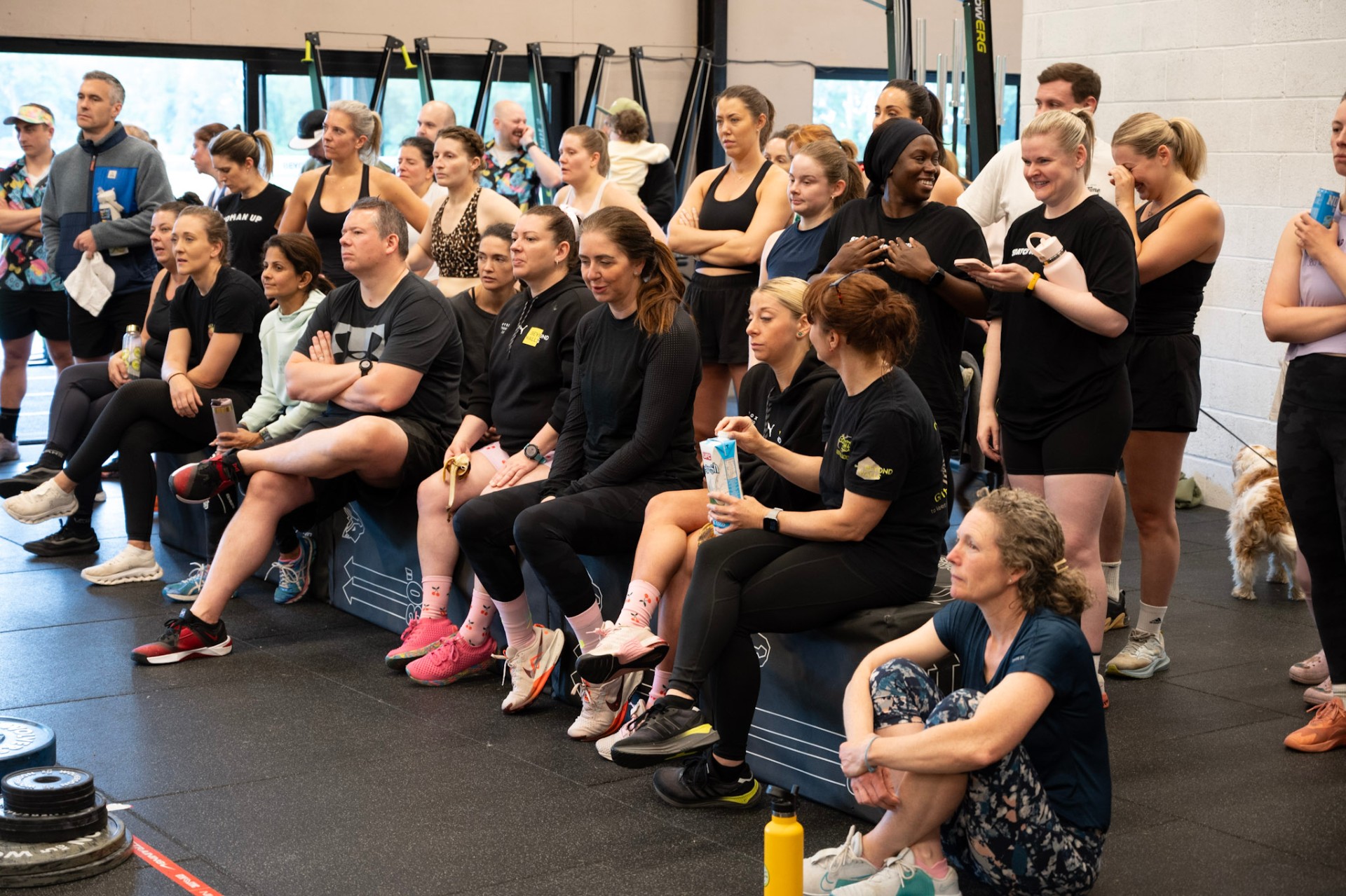 Members watching and cheering during a class event